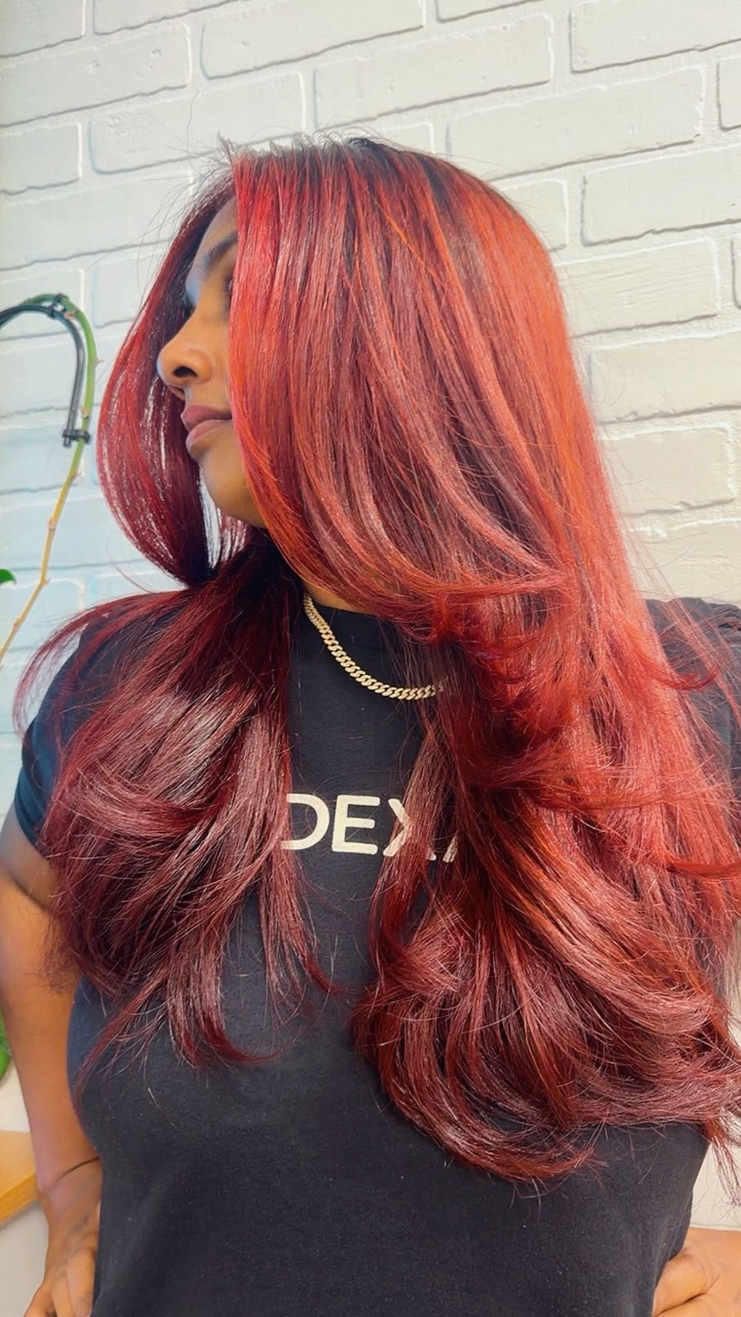 Rich red-wine dimensional color with silky movement, styled at the studio